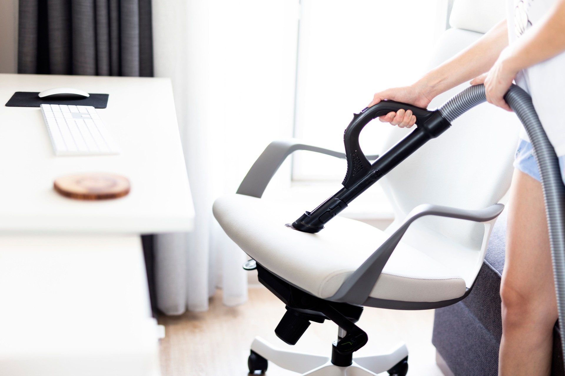 Cleaning of an office chair with vacuum cleaner